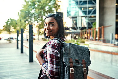 Buy stock photo Rearview shot of a young female student walking around campus