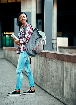 Buy stock photo Shot of a young female student outside on campus