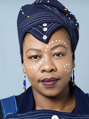 Buy stock photo African woman, portrait and traditional fashion with indigenous style and confidence in head scarf. Person, pride and tribal dots on face for empowerment and culture on studio background in Africa