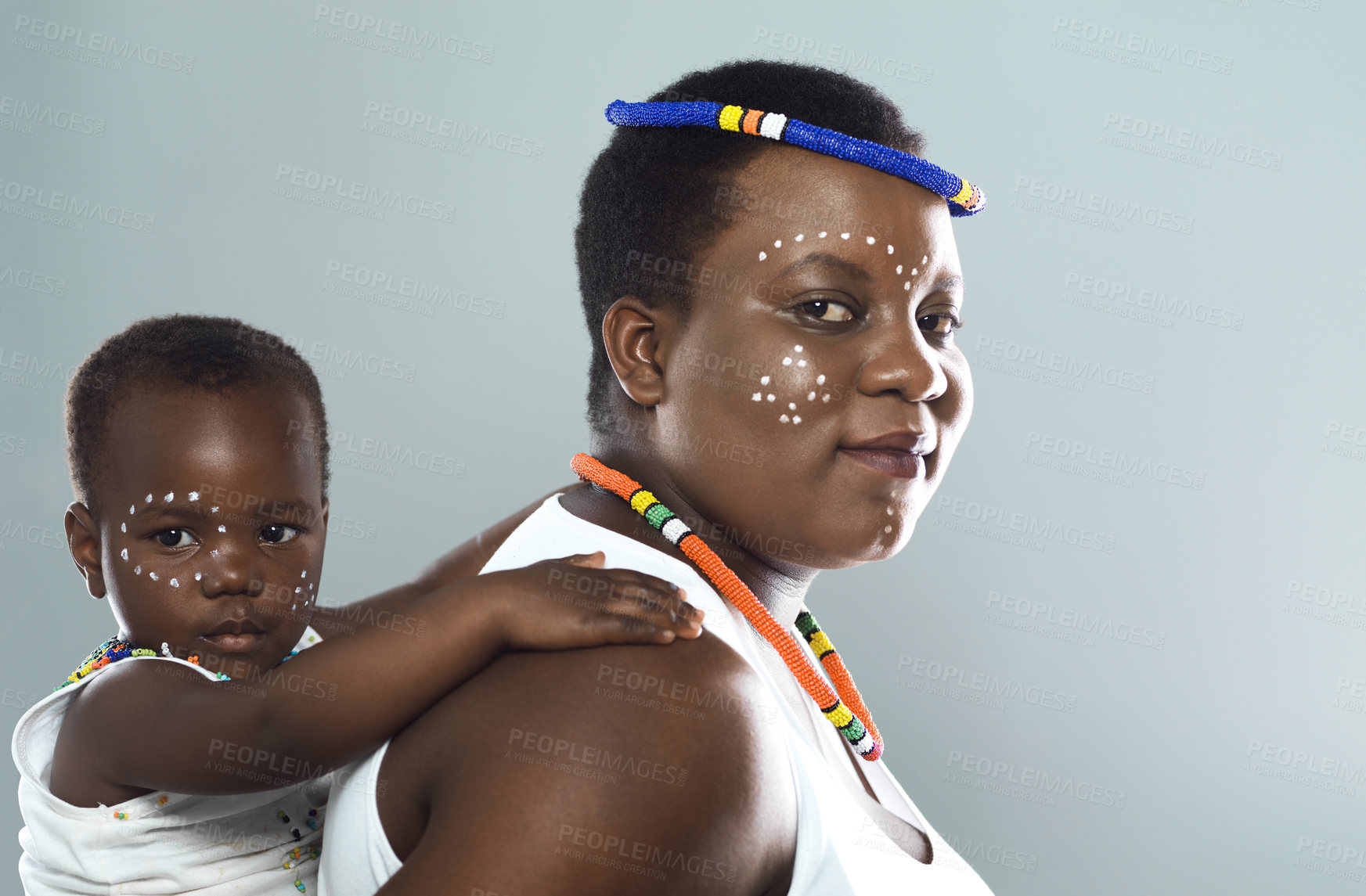 Buy stock photo Black family, piggyback and portrait with child for support, care and love in studio. Carry, smile and African woman with girl for bonding with traditional, cultural heritage on grey background