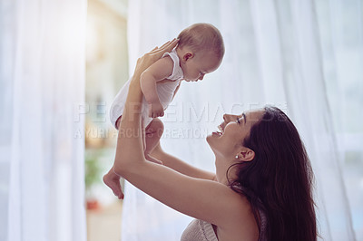 Buy stock photo Happy mother, playing and bonding with baby in air for love, care or motherhood at home. Morning of mom holding  for family, newborn or young infant for youth, holiday or weekend together at house