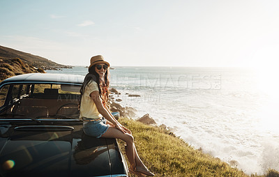 Buy stock photo Portrait of a young woman enjoying a road trip along the coast