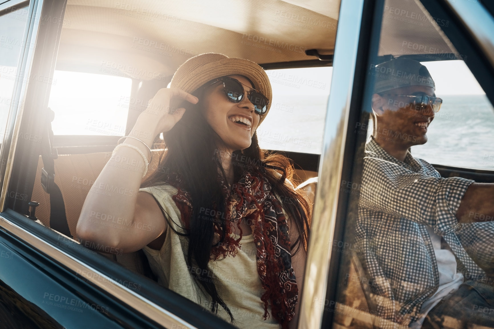 Buy stock photo Happy couple, together and on a road trip in a car for freedom, travel and holiday. Smile, relax and a young man and woman in transportation driving for a vacation, date or an adventure in summer