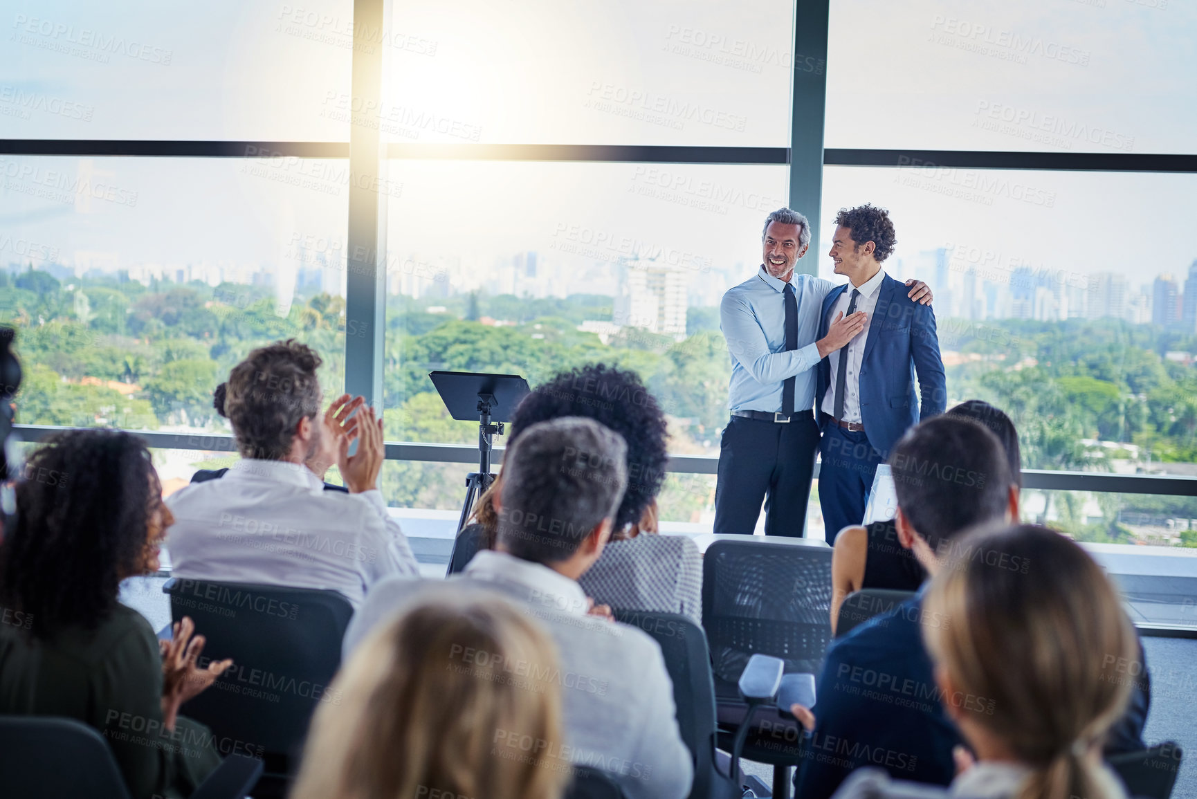 Buy stock photo Professional, presentation and applause during a seminar at the workplace with people in the audience. Business, employees and congratulations during conference for awards in career at the office.