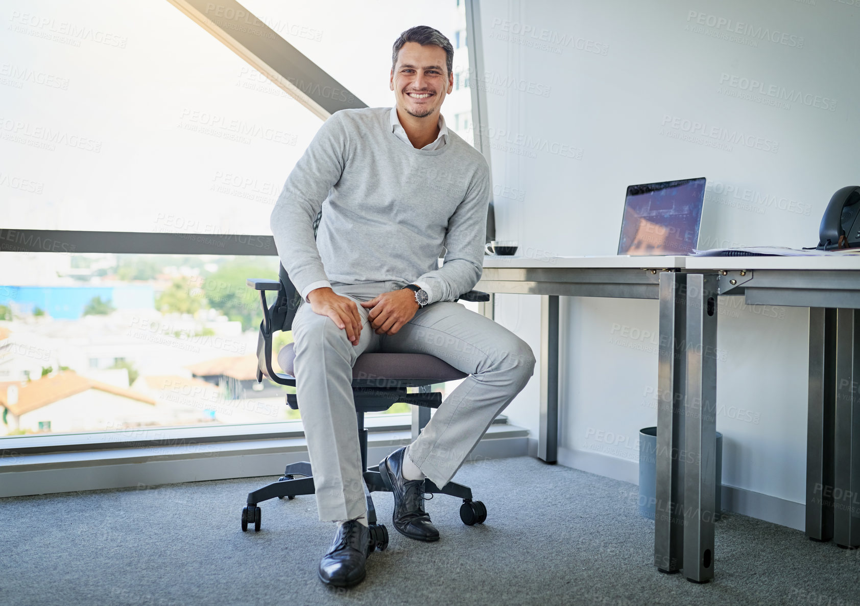 Buy stock photo Happy businessman, portrait and office with laptop for career, job or web design at workplace. Young man, designer or employee with smile for creative opportunity, productive startup or development