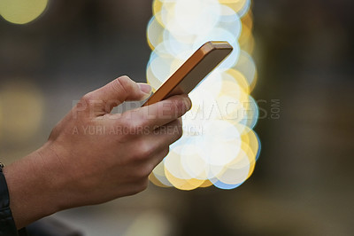Buy stock photo Hands, bokeh and phone for typing in city, internet scroll and web browsing at night mockup space. Cellphone, hand closeup and woman networking, online social media and mobile texting in urban street