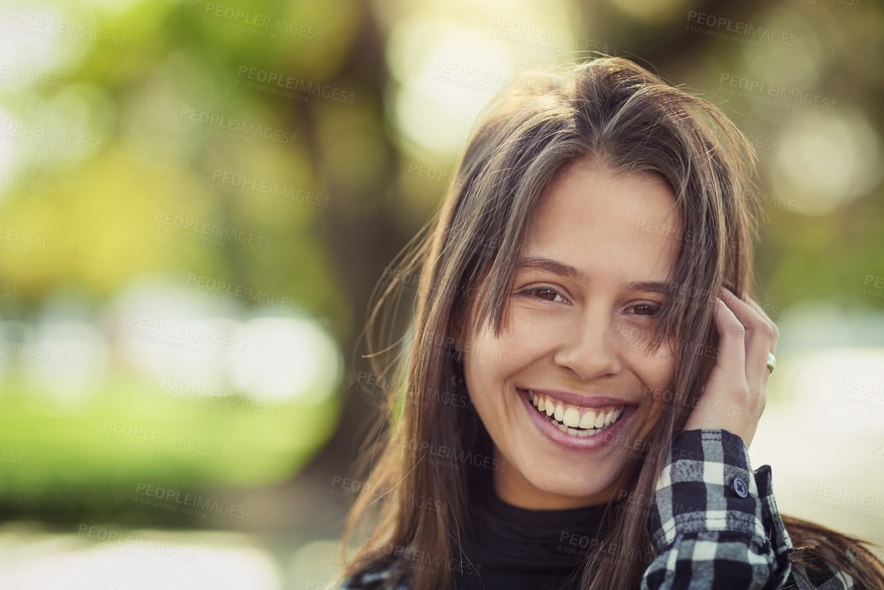 Buy stock photo Cropped portrait of an attractive young woman spending a day in the park