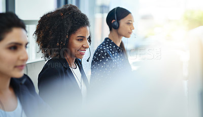 Buy stock photo Shot of young women working in a call centre