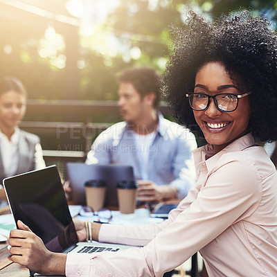 Buy stock photo Portrait of a young businesswoman having a meeting with her colleagues at a cafe