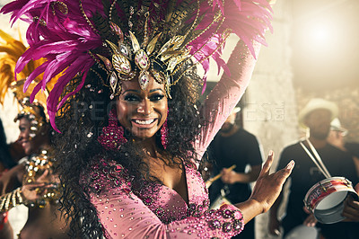 Buy stock photo Cropped portrait of a beautiful samba dancer performing at Carnival with her band