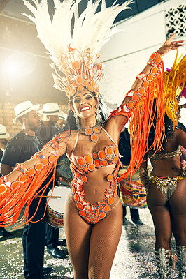 Buy stock photo Cropped portrait of a beautiful samba dancer performing at Carnival with her band
