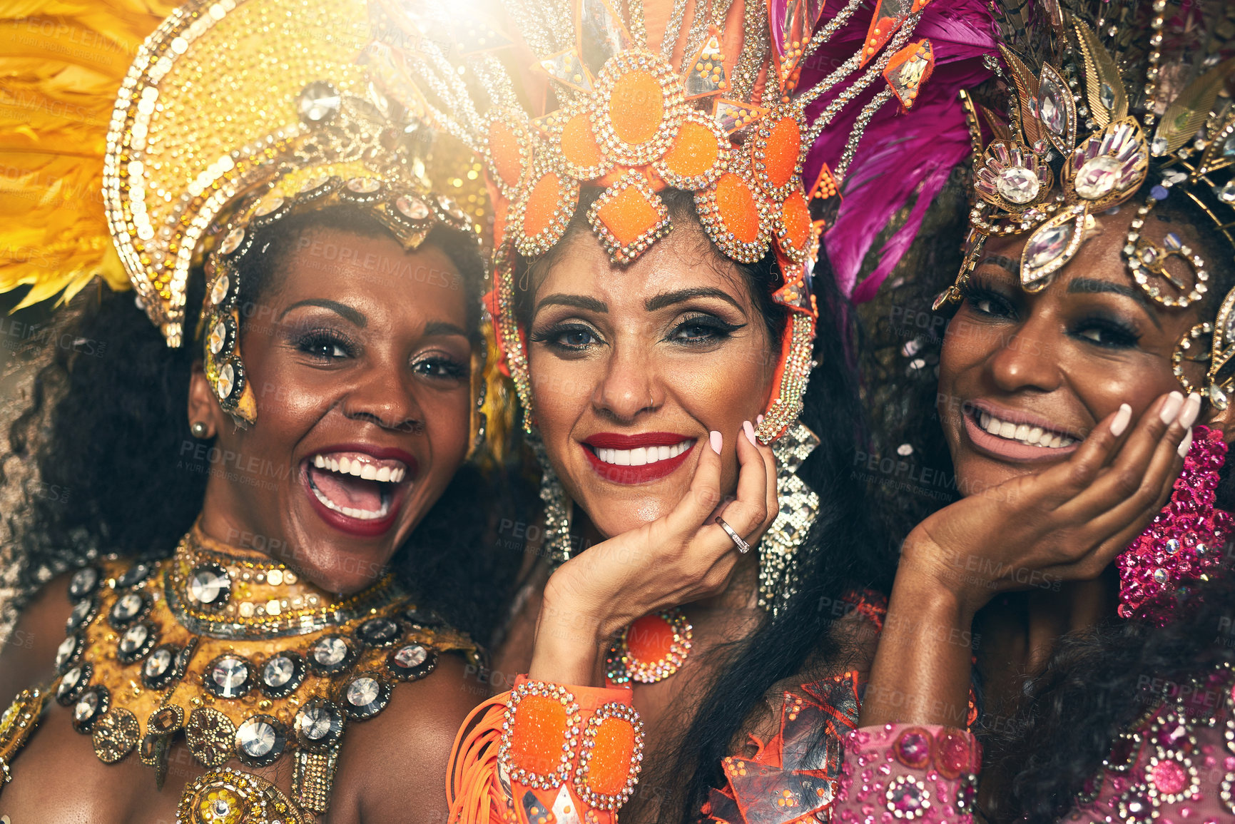Buy stock photo Cropped portrait of three beautiful samba dancers performing at Carnival