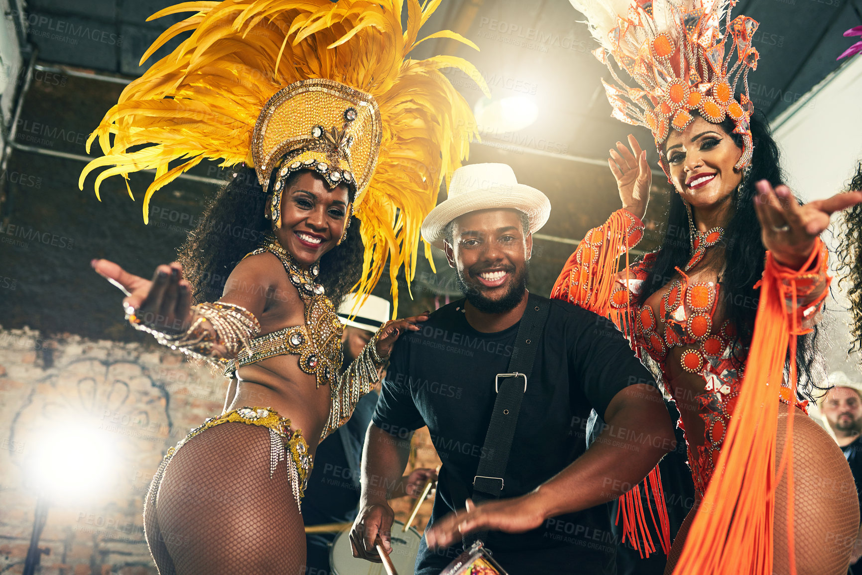 Buy stock photo Carnival, brazil and band with woman dancers outdoor together for a new year celebration in rio de janeiro. Portrait, party and event with a man and female performance artists celebrating tradition