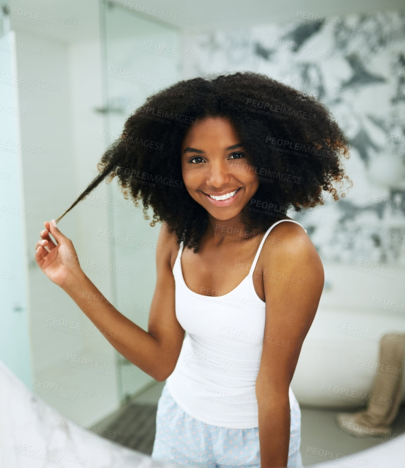 Buy stock photo Hair care, smile and portrait of black woman in bathroom with afro, growth and natural curls. Gen z girl, happy and grooming in morning for wellness, texture and routine treatment at home by mirror