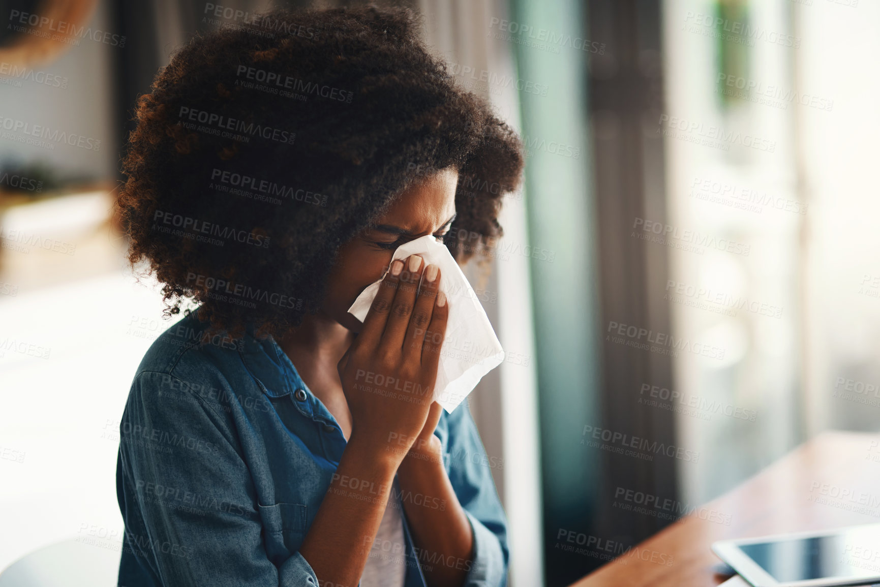 Buy stock photo Black woman, sick and blowing nose with tissue for allergy season, sinus problem and fever in home. African girl, toilet paper and sneeze for allergies with congestion, healthcare and medical crisis