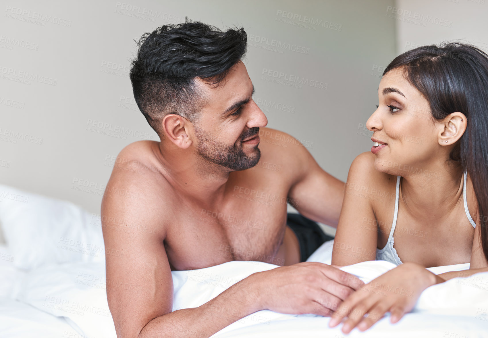 Buy stock photo Love, talking and morning with couple in bedroom for romance, valentines day and marriage. Honeymoon, getaway and happy with man and woman at home or staycation for anniversary retreat and trust