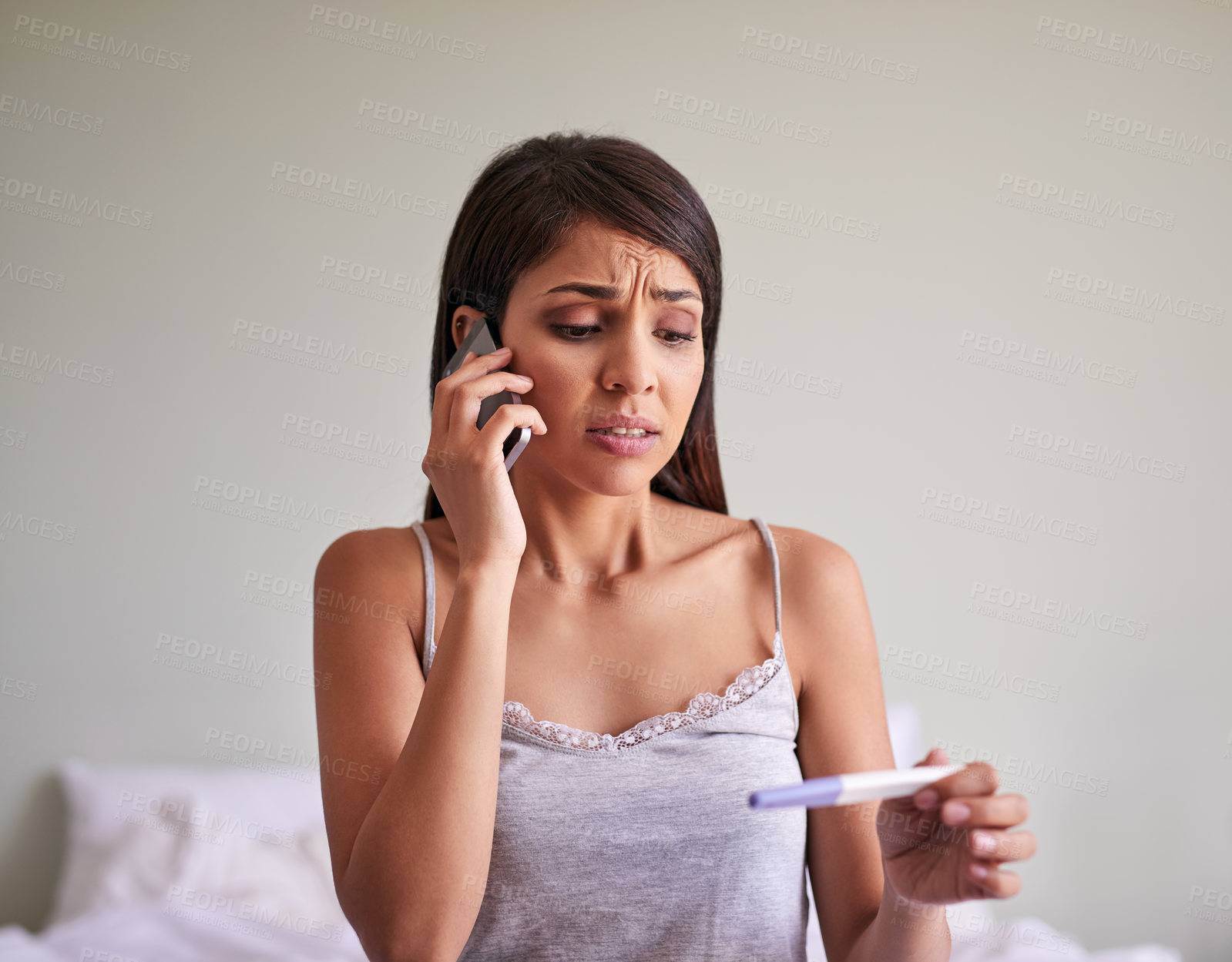 Buy stock photo Woman, phone call and pregnancy test with anxiety communication and connection in bedroom or house. Female person, reading and results as nervous for news, information or announcement in conversation