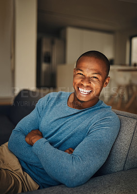 Buy stock photo Portrait of a handsome young man relaxing at home