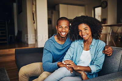 Buy stock photo Portrait of an affectionate young couple relaxing at home