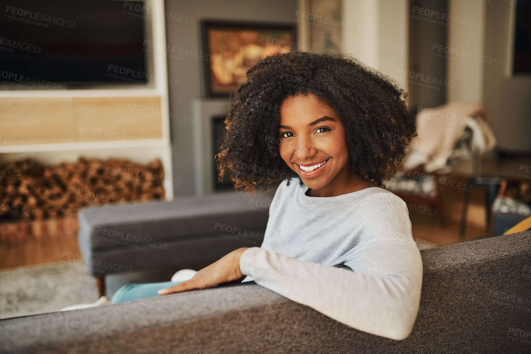 Buy stock photo Portrait of an attractive young woman relaxing at home