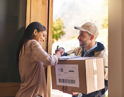 Buy stock photo Shot of a young woman signing for her delivery from the courier