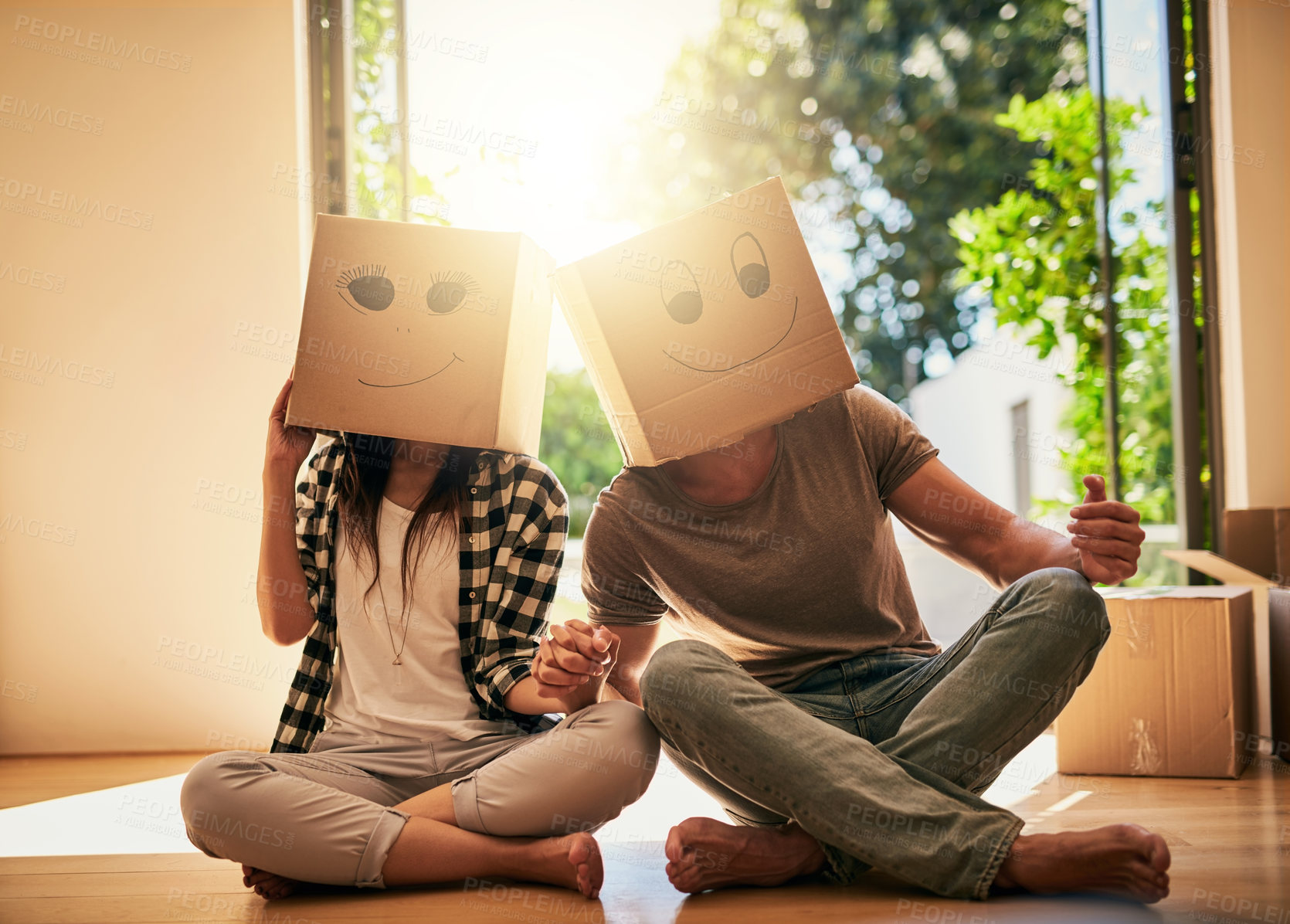 Buy stock photo Couple, play and cardboard with boxes at home of moving day, comedy renovation and property investment. People, funny drawing and new house with future security, comic celebration and emoji game