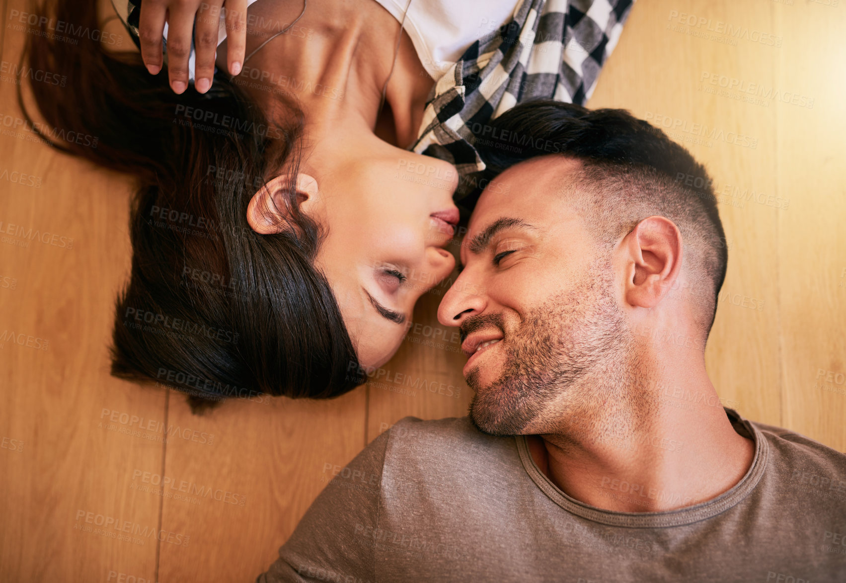 Buy stock photo Couple, floor and kiss for relax in home, living room and ground of new house. Property investment, purchase and top view of excited man and female person, married and mortgage or real estate project