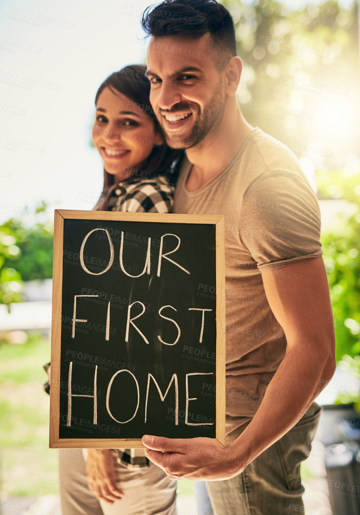 Buy stock photo Portrait of a young couple moving into a new place