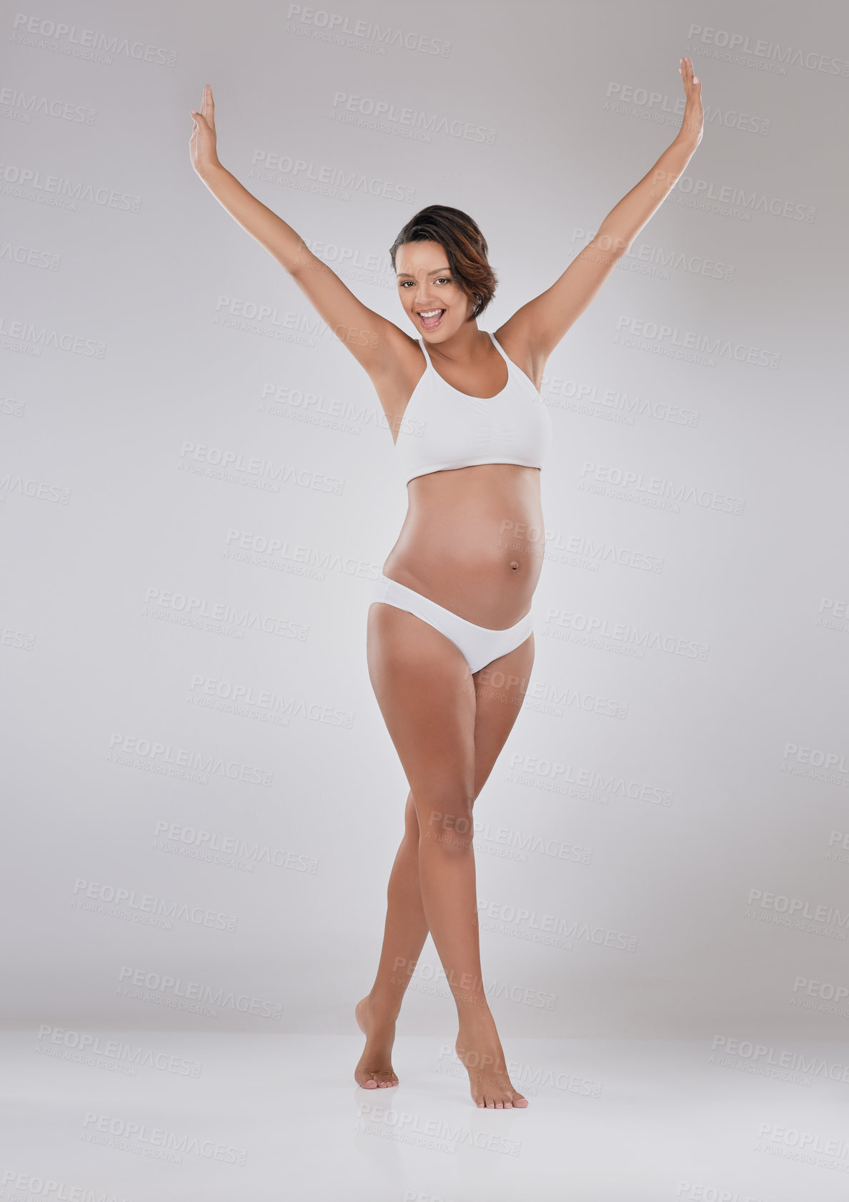 Buy stock photo Happy woman, portrait or pregnant with underwear for motherhood or vitality in studio on a gray background. Young, female person or excited model with smile for pregnancy or maternity on mockup space