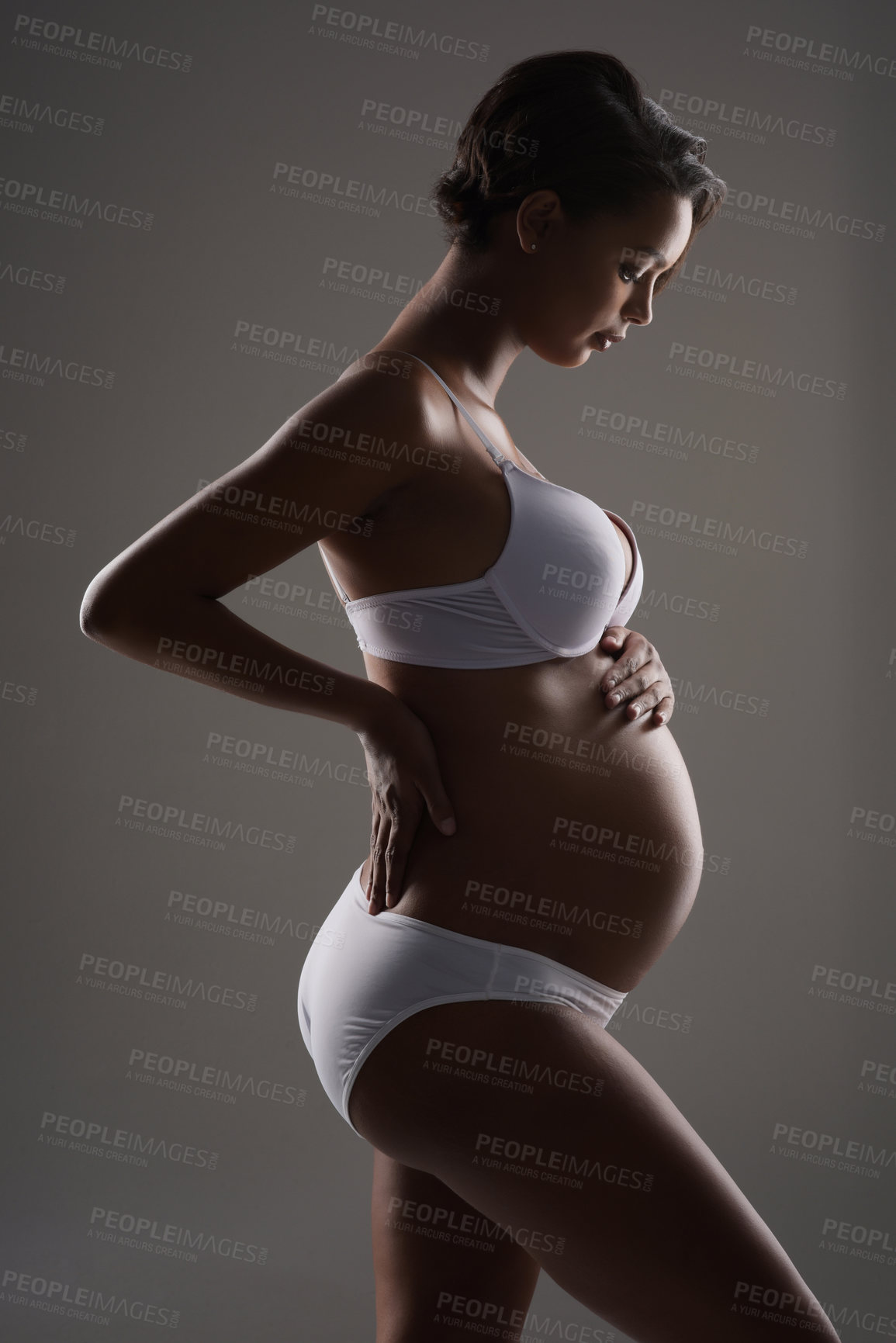 Buy stock photo Pregnancy, profile and underwear with woman in studio for belly size, gynecology and maternal. Prenatal health, growth and development with body of pregnant person on white background for motherhood