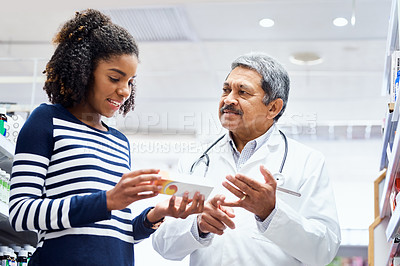 Buy stock photo Pharmacist, woman and help in store with medicine, shopping with professional support. Pharmacy, people and together for healthcare service with advice for dosage, pill info for customer with flu