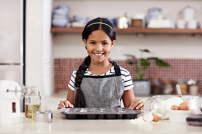 Buy stock photo Cropped shot of an adorable little girl baking in the kitchen at home