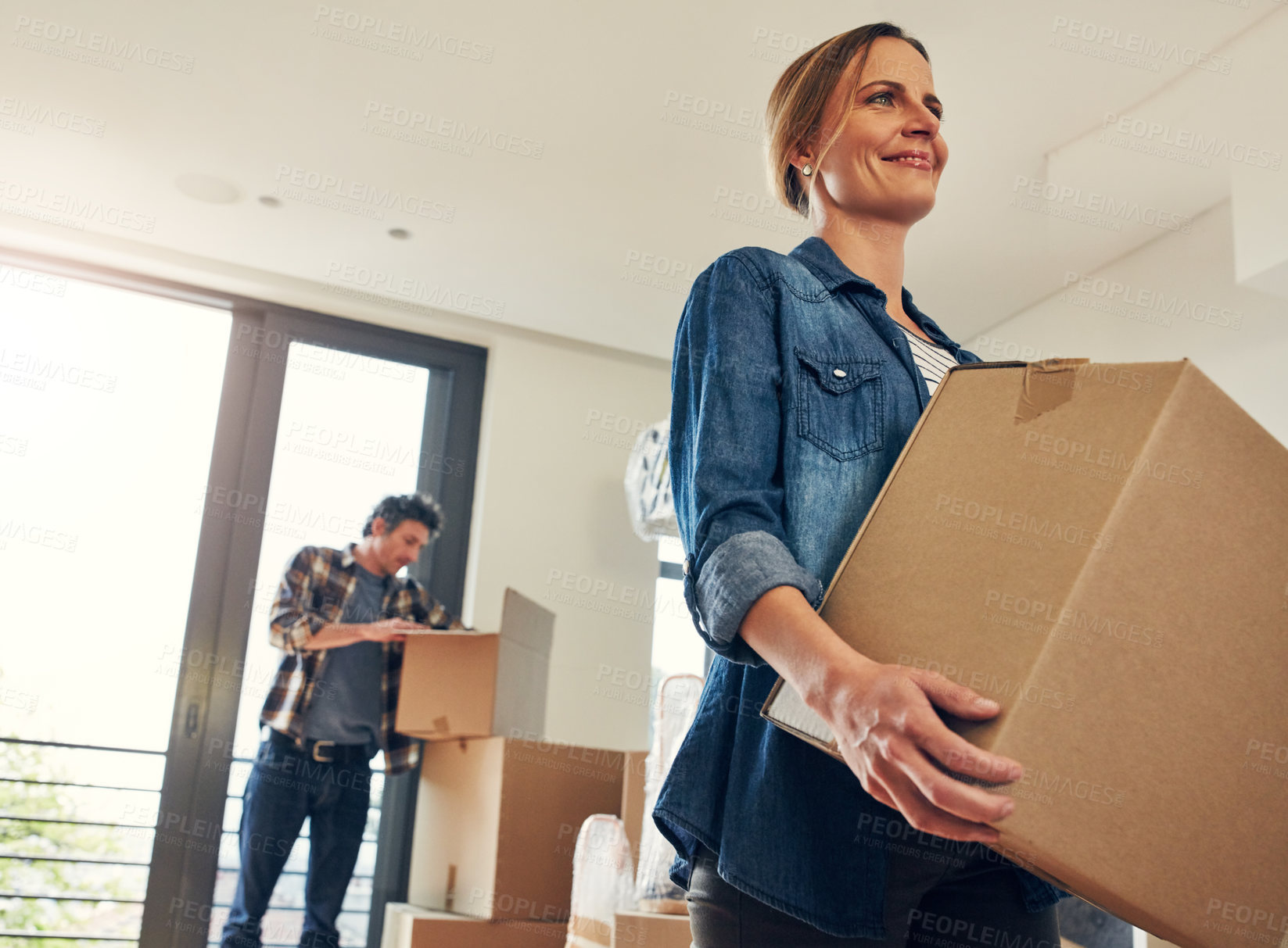 Buy stock photo Moving, property and happy woman holding box for house sale, mortgage and real estate investment. New home, package and couple with cardboard for relocation, unboxing or partner packing in apartment