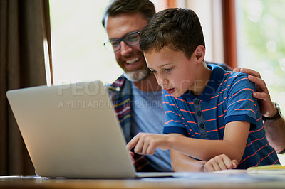 Buy stock photo Happy father, boy or online learning with laptop for assignment, project or education at home. Dad, child or son with smile on computer for research, elearning or virtual assessment on table at house