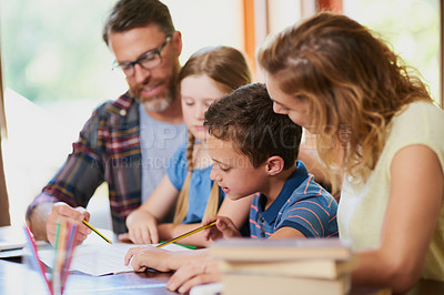 Buy stock photo Family, children and learning with books on table for homework, education or assignment at home. Mother, father and kids with assistance for school project, assessment or guidance together at house