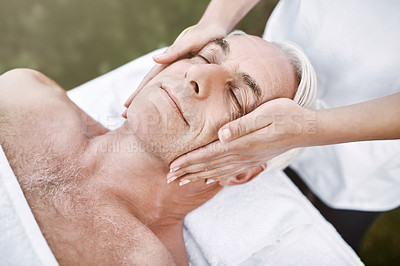 Buy stock photo Senior man, relax and face with massage for luxury treatment or physical therapy at outdoor spa. Mature male person with masseuse in stress relief, zen or relaxation for facial care at beauty salon