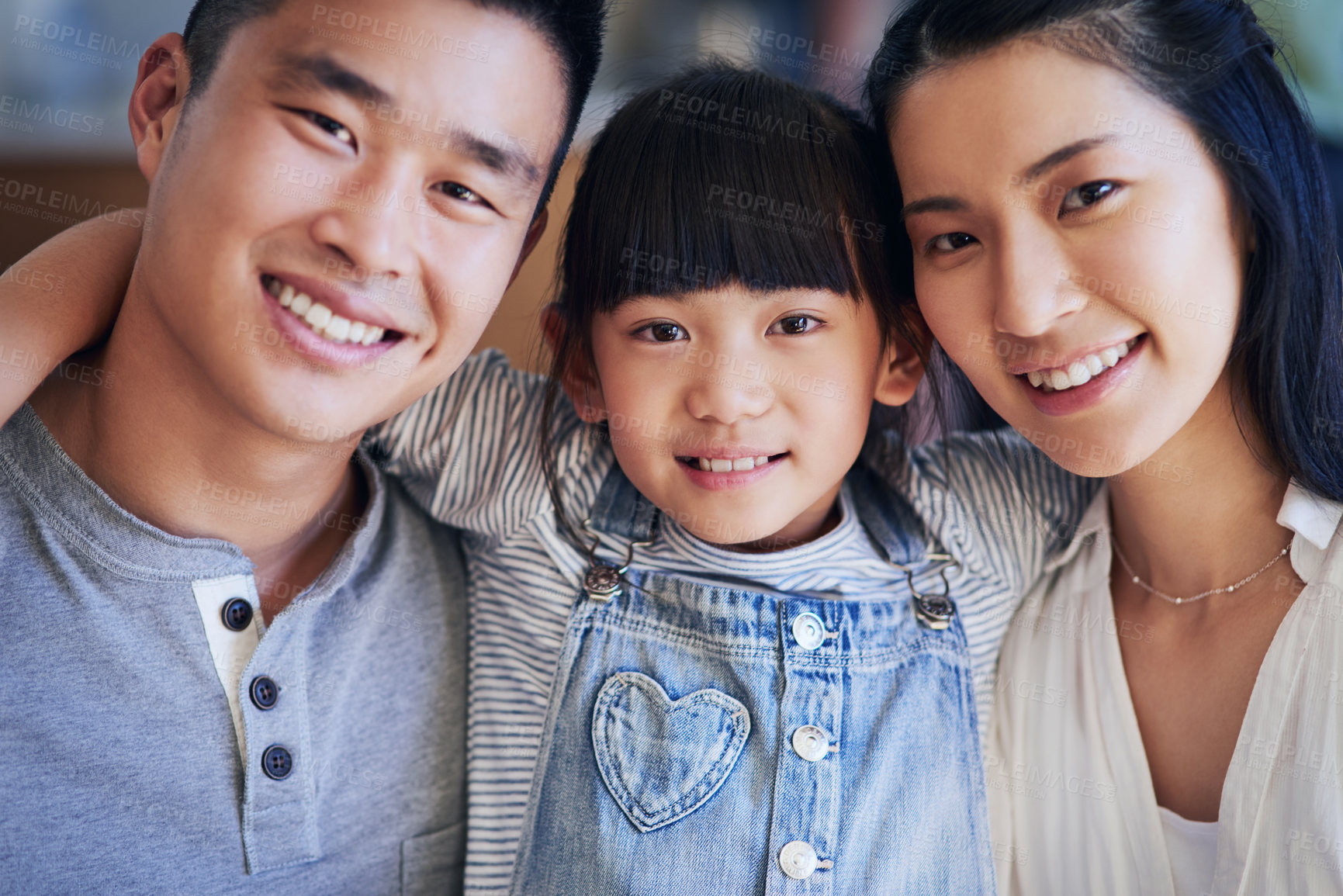 Buy stock photo Asian family, portrait and smile in home with hug for bonding, support and relationship together. Mother, father and young girl in house with happy, trust and care for love, relax and weekend leisure