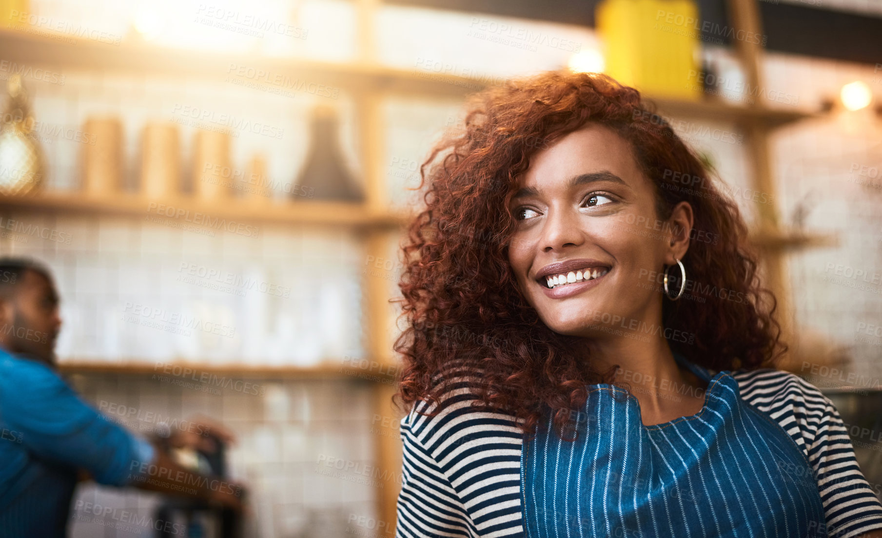 Buy stock photo Cropped shot of an attractive young woman standing in her coffee shop