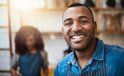 Buy stock photo Cropped portrait of a handsome young man standing in his coffee shop