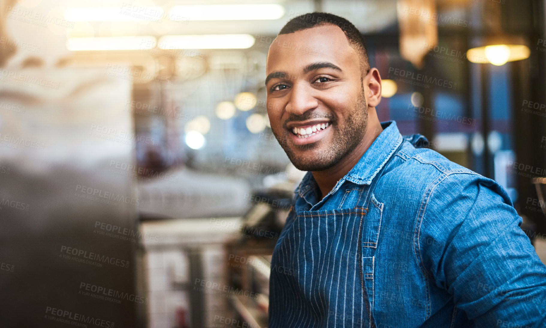 Buy stock photo Cropped portrait of a handsome young man standing in his coffee shop