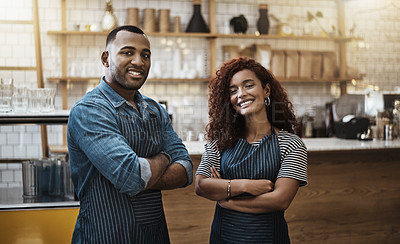 Buy stock photo Portrait of two young entrepreneurs standing in their cafe