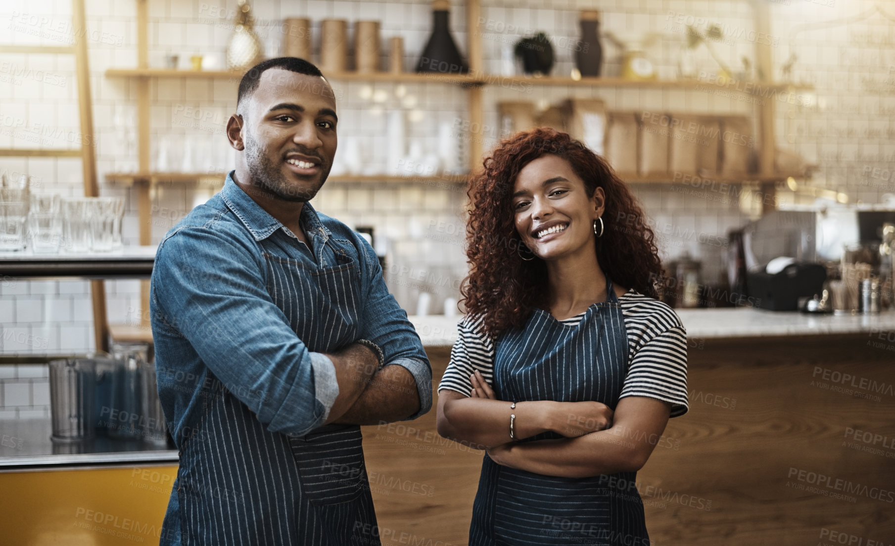 Buy stock photo Portrait of two young entrepreneurs standing in their cafe