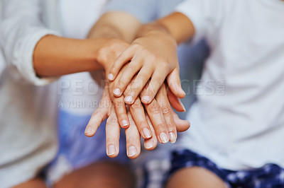 Buy stock photo Closeup shot of an unrecognizable family of three with their hands in a pile
