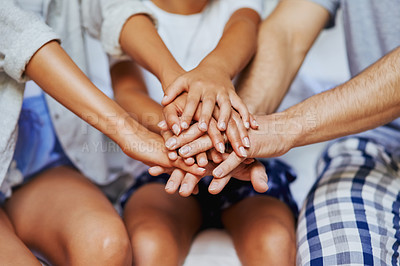 Buy stock photo Closeup shot of an unrecognizable family of three with their hands in a pile