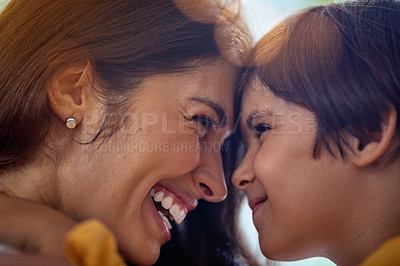 Buy stock photo Cropped shot of a mother and her young son bonding at home