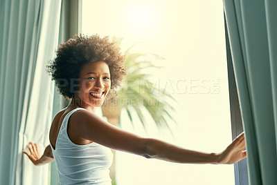 Buy stock photo Cropped shot of an attractive young woman opening the curtains in her bedroom at home