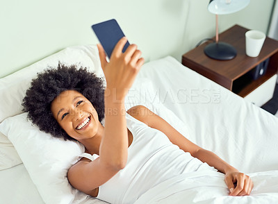 Buy stock photo Black woman, selfie and home bed with smile in morning with social media post and profile picture. Pillow, happy and online web photo for content creation, internet and app in a bedroom with tech