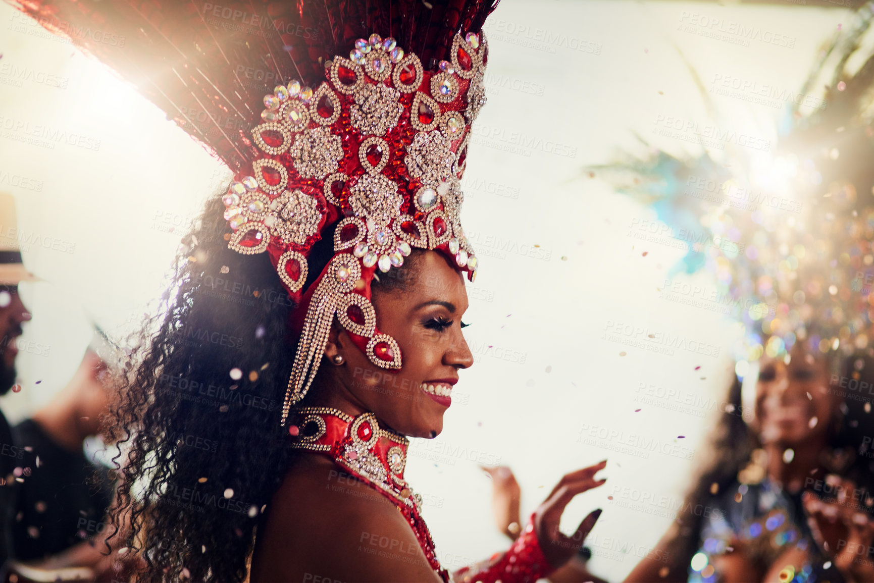 Buy stock photo Woman, dancer and excited at carnival, smile and performance with feather crown for culture. Person, happy and costume with talent, art and tradition for celebration, festival or nightclub in Brazil