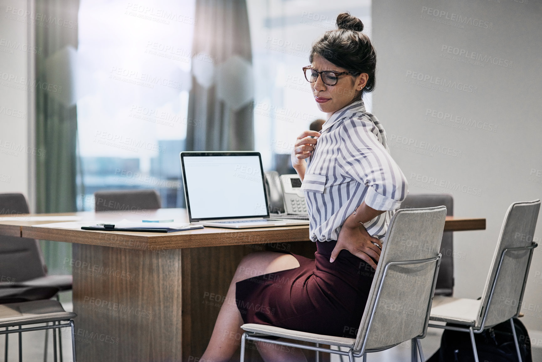 Buy stock photo Woman, back pain and laptop in office with burnout, discomfort and muscle tension with mockup. Female lawyer, accident and fatigue in workplace with bad posture, overworked and stress in law firm