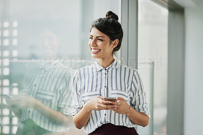 Buy stock photo Business woman, thinking and phone with goal at office window with smile and idea. Female employee vision and mobile connection of a worker feeling happy on social media and technology at company